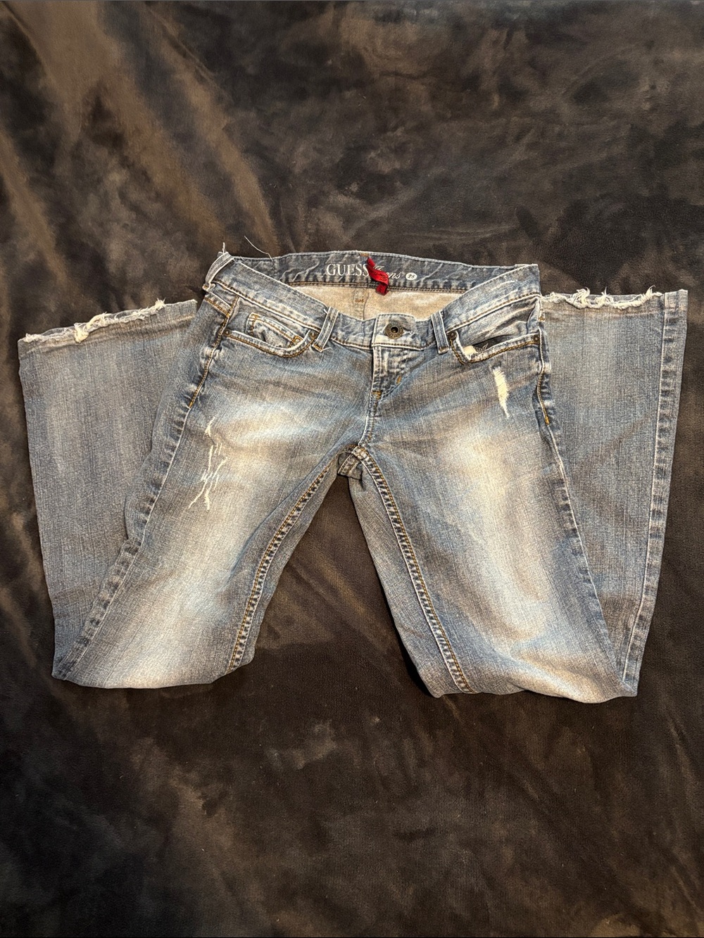 Vintage Guess Women's Faded Light Blue Bootcut Jeans with Distressed Details
